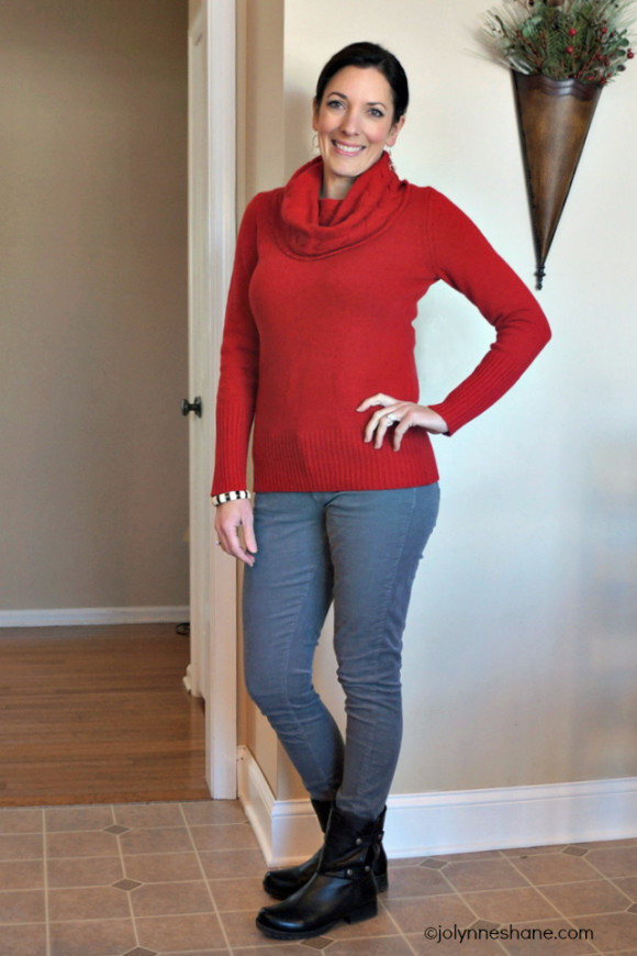 red cable turtleneck sweater with gray jeans