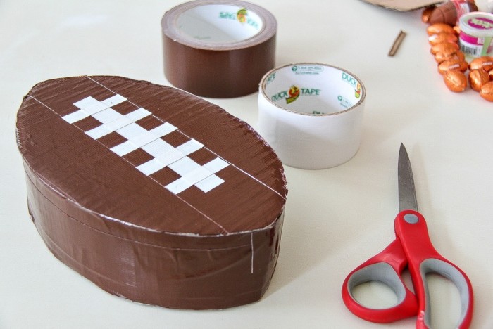 DIY mini football piñata: a great Game Day activity for kids that is sure to keep them occupied while you cheer on your favorite team!