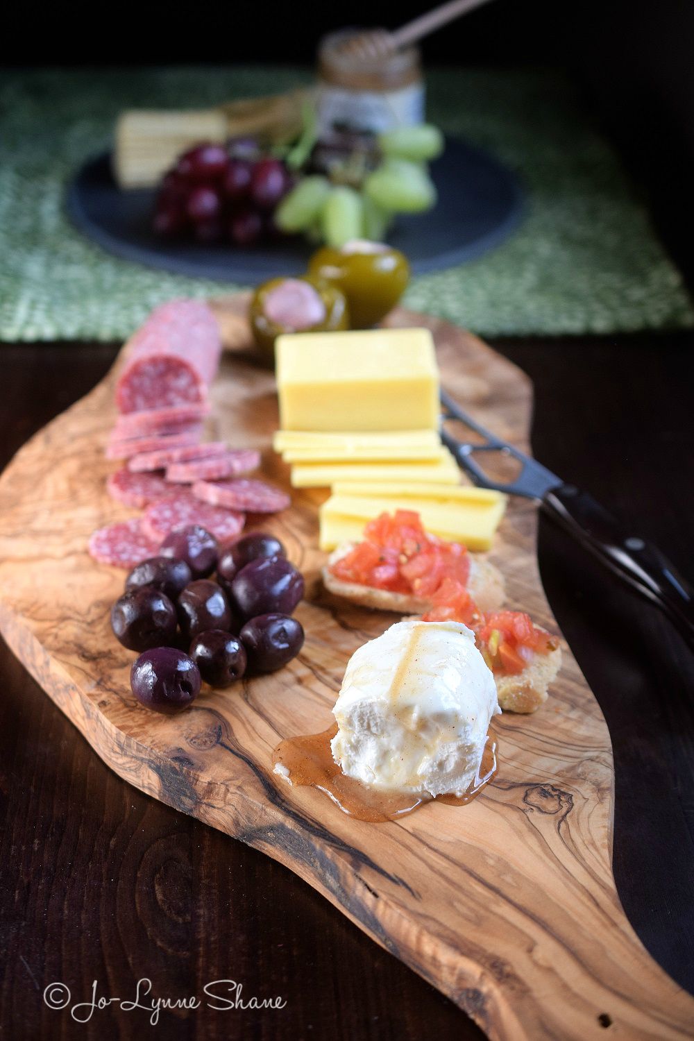 Cheese & Fruit on a Cutting Board makes a rustic and beautiful presentation for casual entertaining!