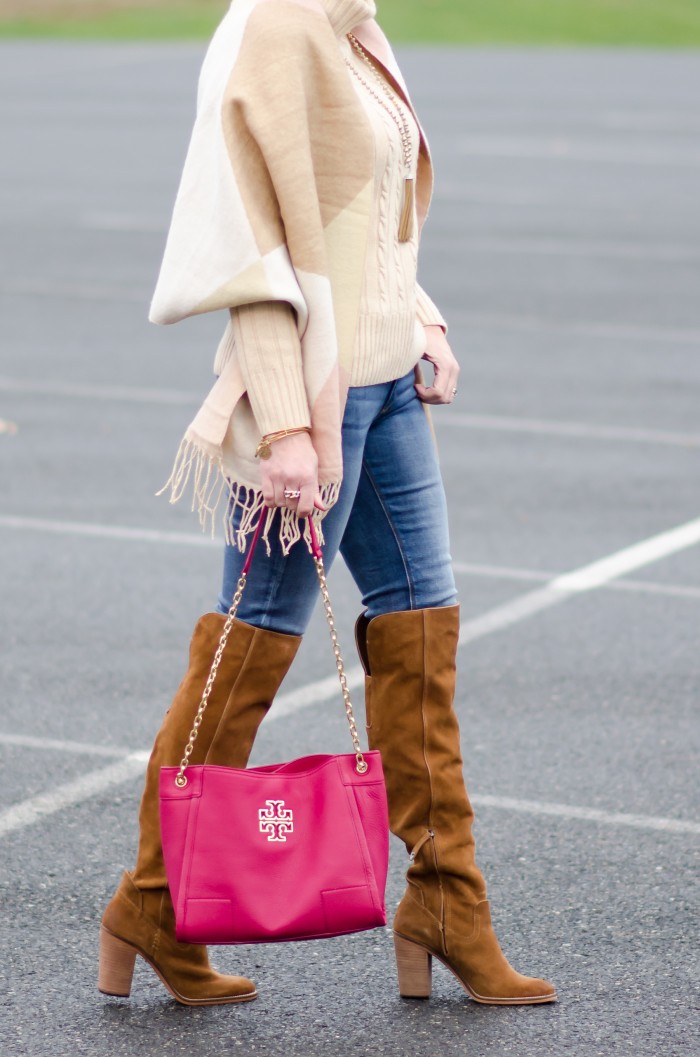 Winter Fashion for Women Over 40: pastel scarf, chunky cable turtleneck, skinny jeans, over the knee boots, and Tory Burch Britten Slouchy Tote