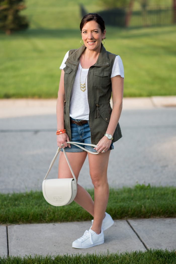 spring outfit: rolled hem denim shorts with white tee and utility vest