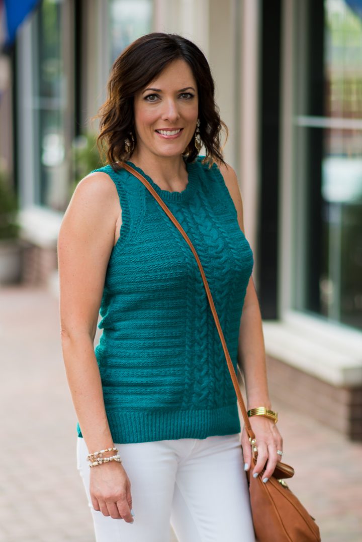 This gorgeous teal sleeveless sweater outfit with cognac accessories is perfect for summer, and the sweater is also a great transition piece for fall.
