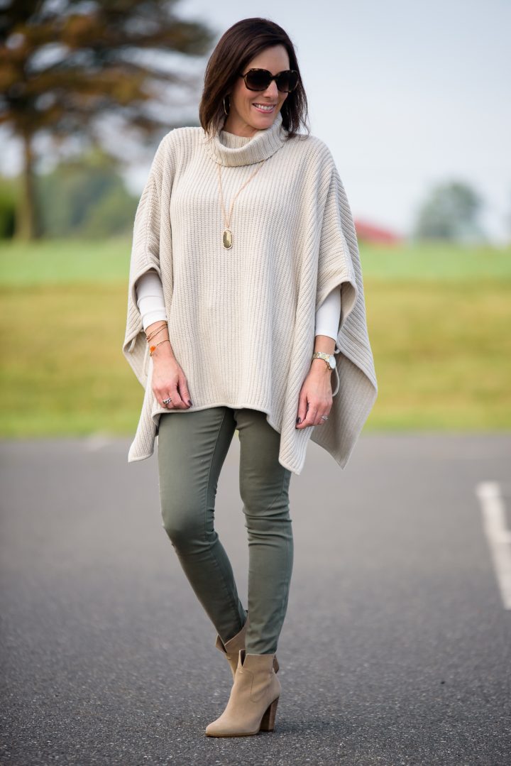 1 of 4 Ways to Wear Ankle Boots this Fall: with a chunky side tie poncho and olive skinny jeans! Click through for 3 more ways to wear ankle boots!