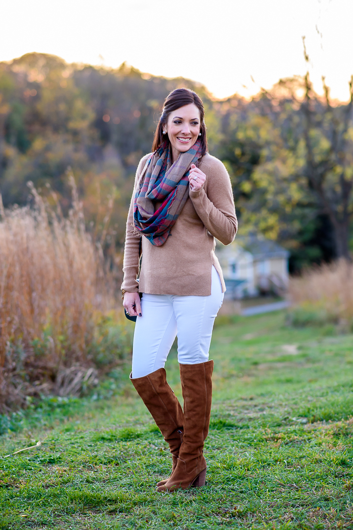 Another great way to style white jeans for fall -- camel cashmere sweater with white skinnies, chestnut over-the-knee boots, and a plaid infinity scarf.