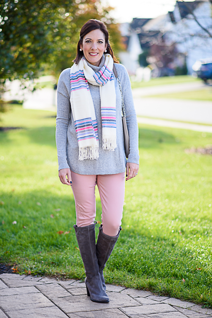 How to Wear Pastels for Fall: Styling this grey turtleneck sweater with pale pink jeans and grey UGG boots. The striped scarf pulls it all together!