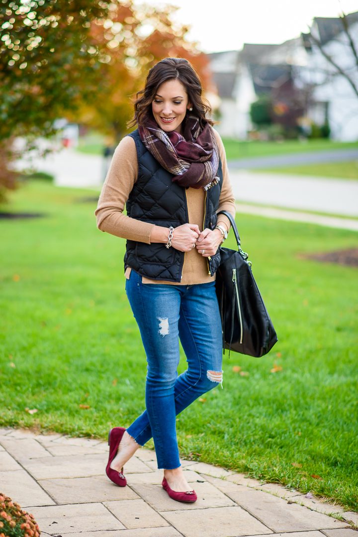 Winter Quilted Vest Outfit with camel cashmere sweater, distressed skinny jeans, plaid scarf, and suede ballet flats