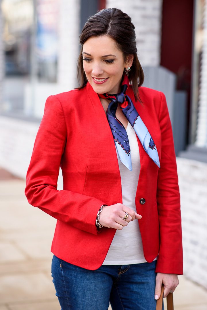 Sharing how to style a red blazer with jeans and a neck scarf. I love mixing dressy and casual pieces for a modern look.