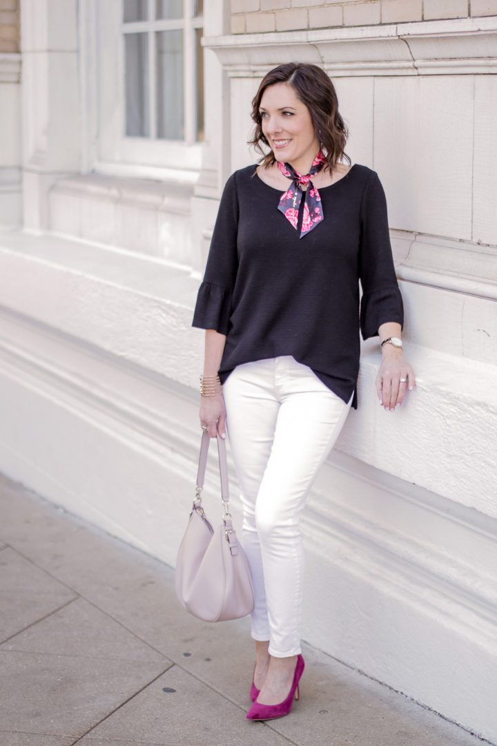 Pink Pumps with white jeans, black top, and neck scarf