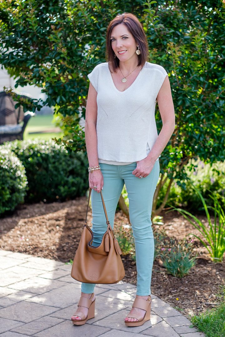 Styling a mint jeans outfit with Lucky Brand mix stitch sweater in ivory. Cognac wedge sandals and hobo handbag complete the look!