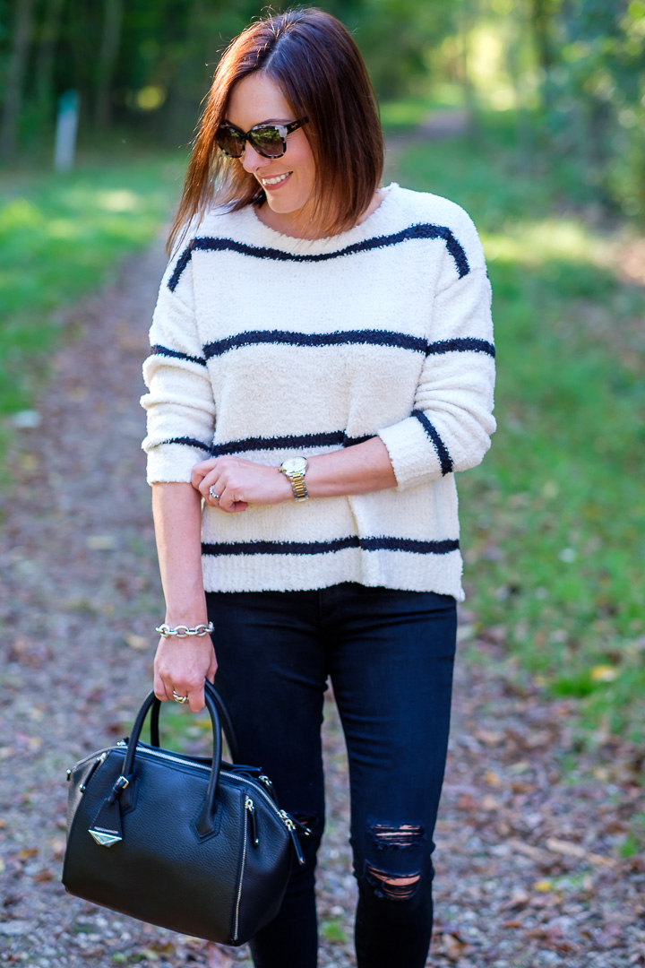 Jo-Lynne Shane wearing BB Dakota striped chenille sweater with slip-on sneakers and distressed black jeans.