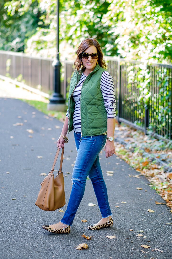 Jo-Lynne Shane styling a Quilted Puffer Vest Outfit with Striped Tee & Leopard Flats for Day 7 of 26 Days of Fall Fashion
