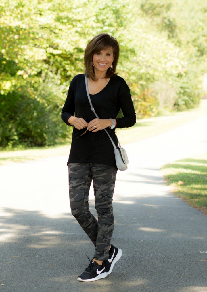 Cyndi Spivey wearing camo leggings and black tunic
