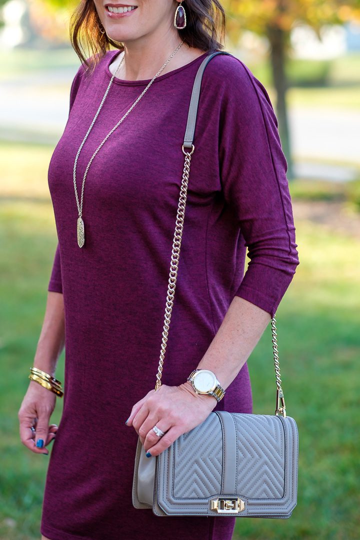 How to accessorize a plum dress with grey and gold.