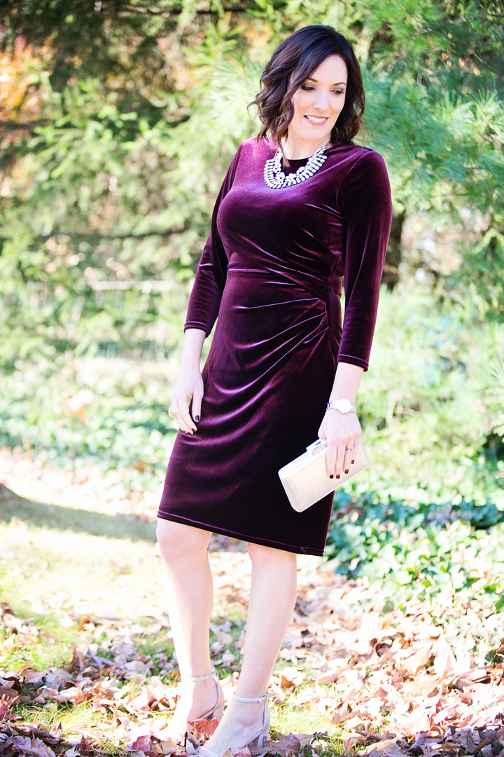 What to wear to a company holiday party -- this festive velvet dress with a glittery statement necklace and sparkly heels is perfect holiday style!
