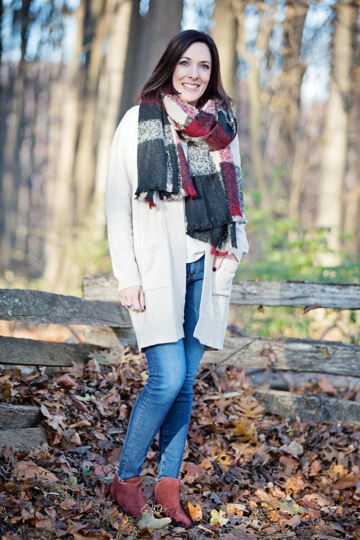 This cozy cardigan outfit with plaid bouclé scarf is perfect for chilly winter days. The burgundy suede booties are the perfect bookend to the outfit.