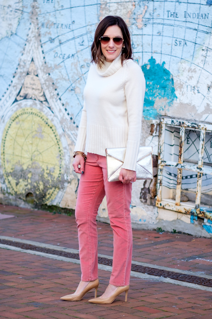 We're talking about how to wear velvet pants for the holidays, and I'm wearing washed velvet pants in faded rust with an off-white sweater and nude pumps.