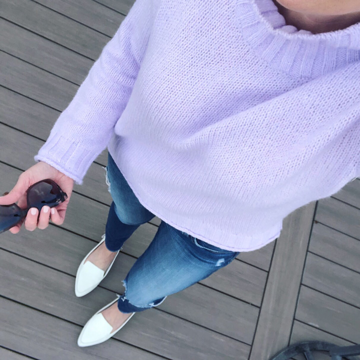 winter outfit: lavender mockneck sweater with AG raw hem ankle skinny jeans and white loafers