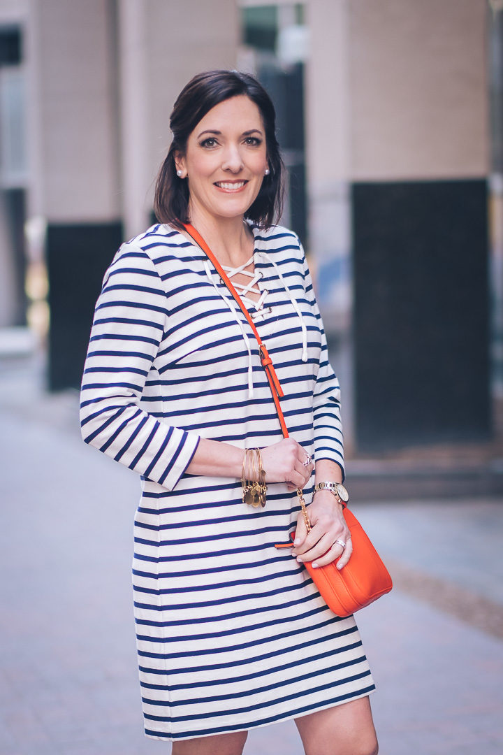 Jo-Lynne Shane wearing Old Navy Lace-Up Yoke Shift Dress in Navy Stripe with Converse Shoreline and Tory Burch Ivy Crossbody in Samba Red #springfashion