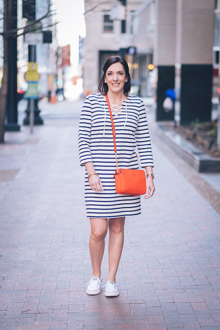 Jo-Lynne Shane wearing Old Navy Lace-Up Yoke Shift Dress in Navy Stripe with Converse Shoreline and Tory Burch Ivy Crossbody in Samba Red #springfashion