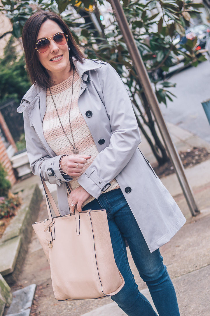 Casual spring outfit featuring Loft striped boatneck sweater, AG middi ankle jeans, Tory Burch Minnie travel flats in French Grey, J.Crew Signet Tote Bag in Soft Blossom, and Michael Kors Core Trench Coat #springfashion