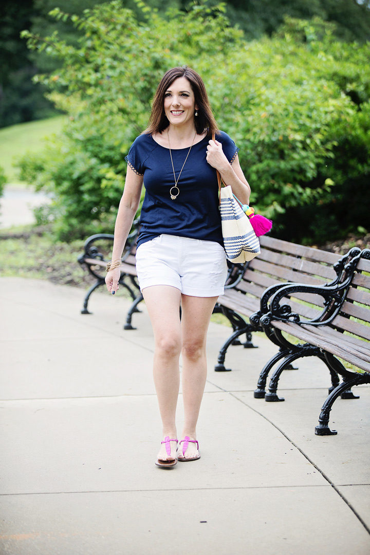 THE PERFECT STRIPED STRAW TOTE FOR SUMMER: This is a simple outfit made up of mostly wardrobe basics, but the navy striped straw tote with colorful pom-pom tassel gives it an extra fun factor that takes it to the next level.