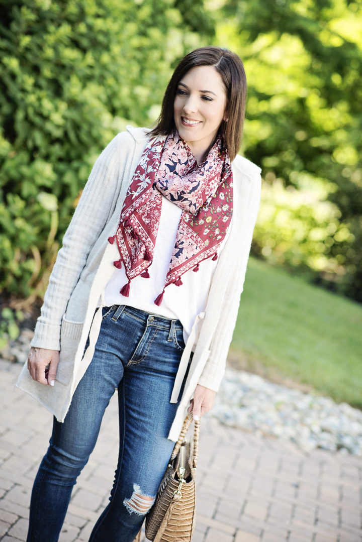 Sharing some of my favorite fall wardrobe basics for women over 40 including a cozy cardigan, classic white t-shirt, dark wash skinny jeans, and loafer drivers.
