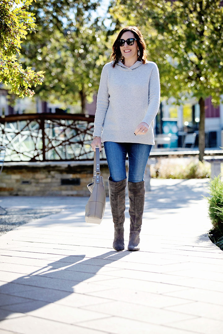 This Loft hooded sweater has a sporty vibe that's perfect for pairing with your favorite blue jeans. I often wear it with my Converse, but I also like this leveled-up casual look with over the knee boots. 