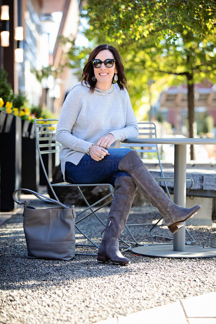 This Loft hooded sweater has a sporty vibe that's perfect for pairing with your favorite blue jeans. I often wear it with my Converse, but I also like this leveled-up casual look with over the knee boots. 