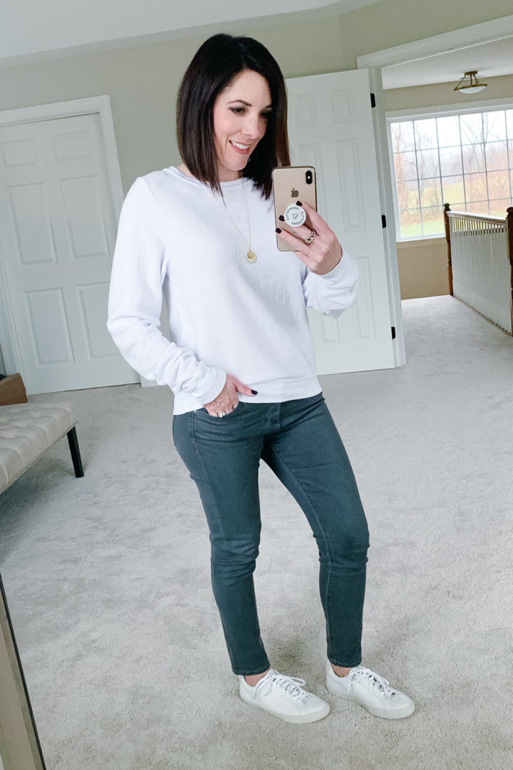 Jo-Lynne Shane wearing WILDFOX Clean White Sweatshirt with AG The Legging Ankle Jeans in Shadow Fog and Veja Esplar Sneakers