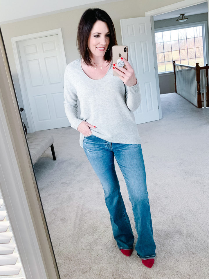Jo-Lynne Shane wearing AG Angel Flare Jeans in 17Y Ceaseless Destructed with Madewell Kimball Sweater and pink Sam Edelman Hazel Pumps 