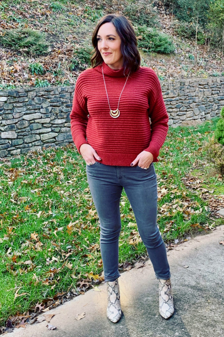 Snake Print booties with grey jeans and a, burgundy sweater