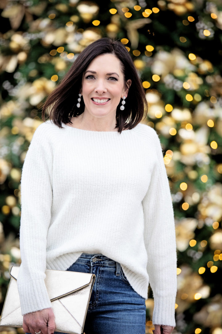 Jo-Lynne Shane wearing a casual New Year's Eve outfit featuring Chelsea28 Rib Metallic Sweater and pave drop earrings