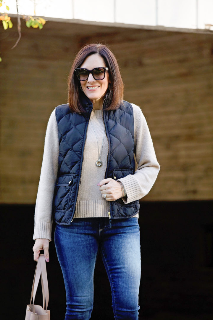 casual outdoor dining outfit for fall with a puffer vest
