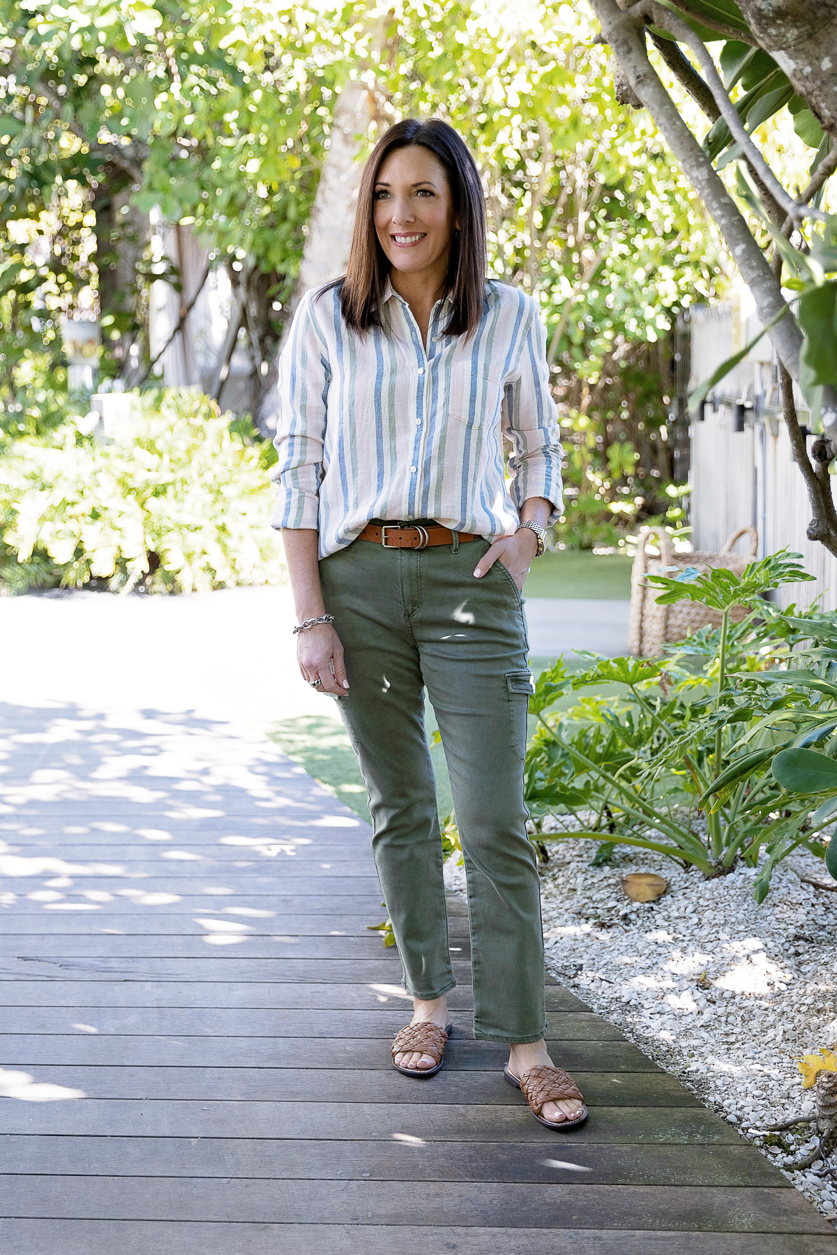 Jo-Lynne Shane wearing PAIGE Jolie Slim Cargo Pants with Caslon stripe button-up shirt and Sam Edelman Griffin Slides in Miami