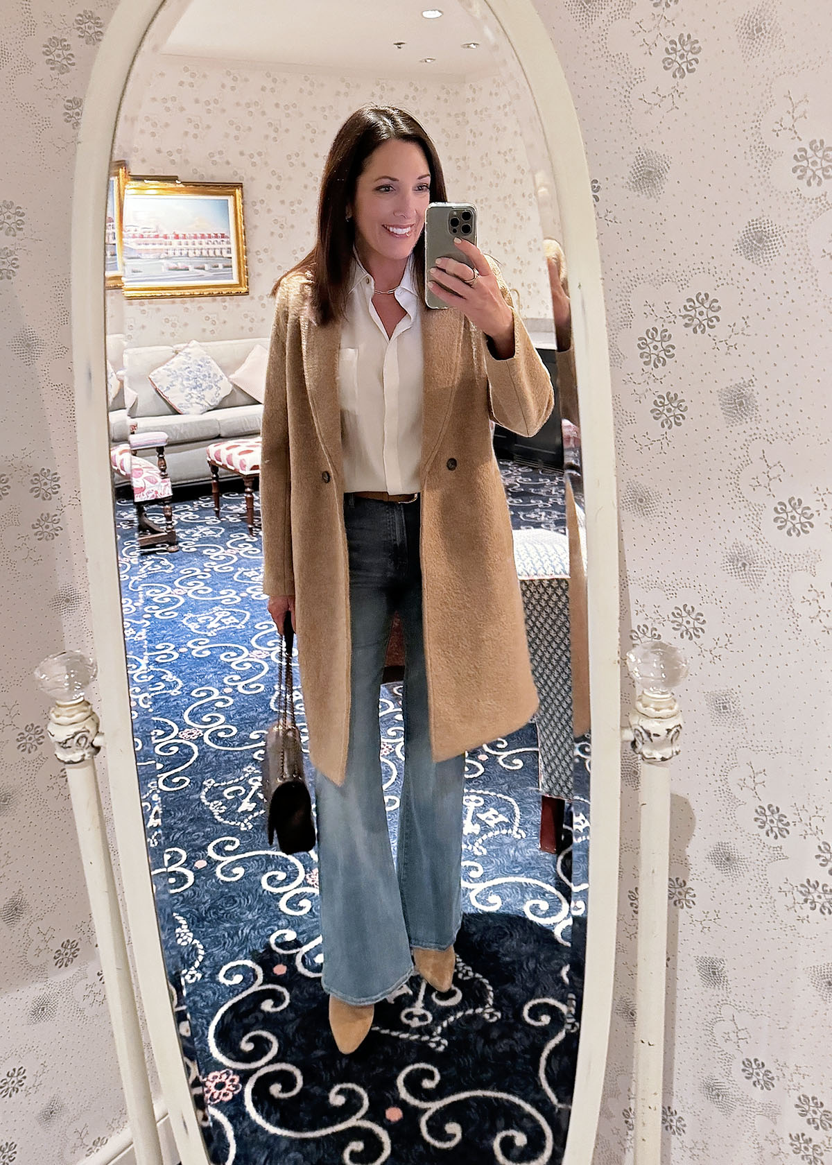 camel topcoat with ivory Vince blouse and FRAME flare jeans